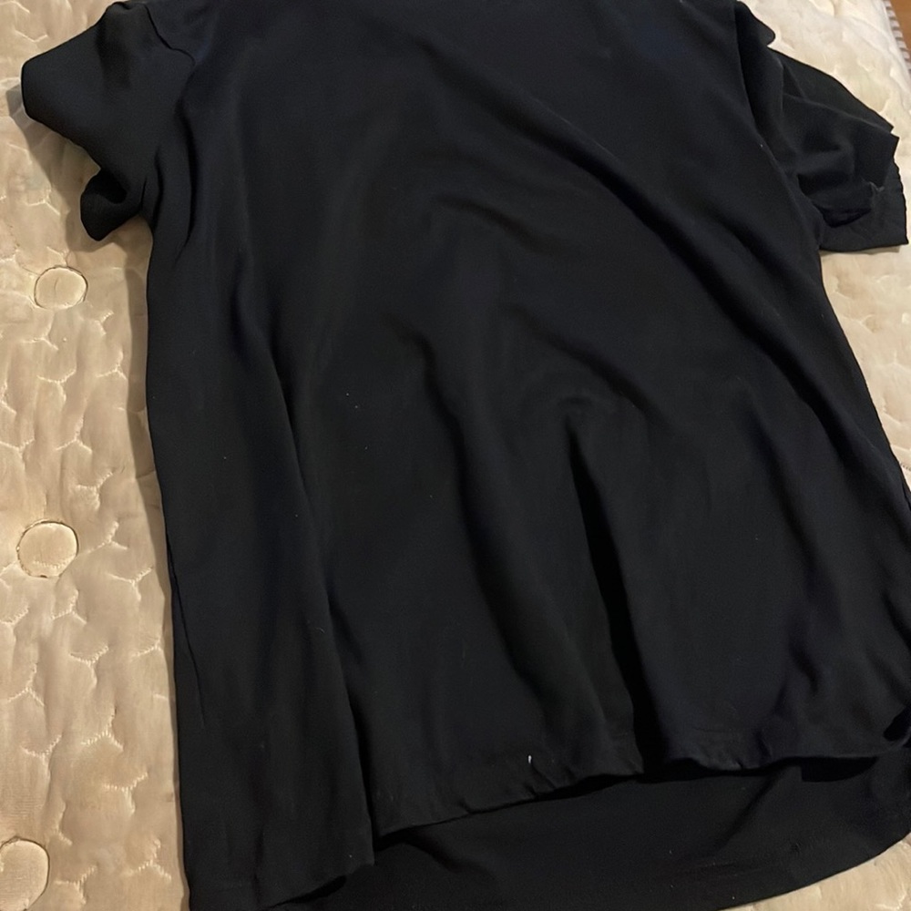 Black tee with a design on the back